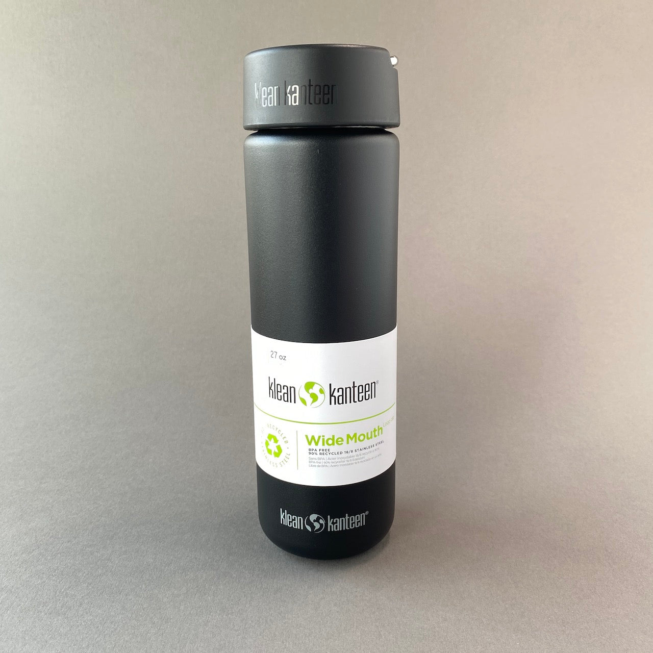 Photo of black  800ml wide mouth water bottle on grey background.