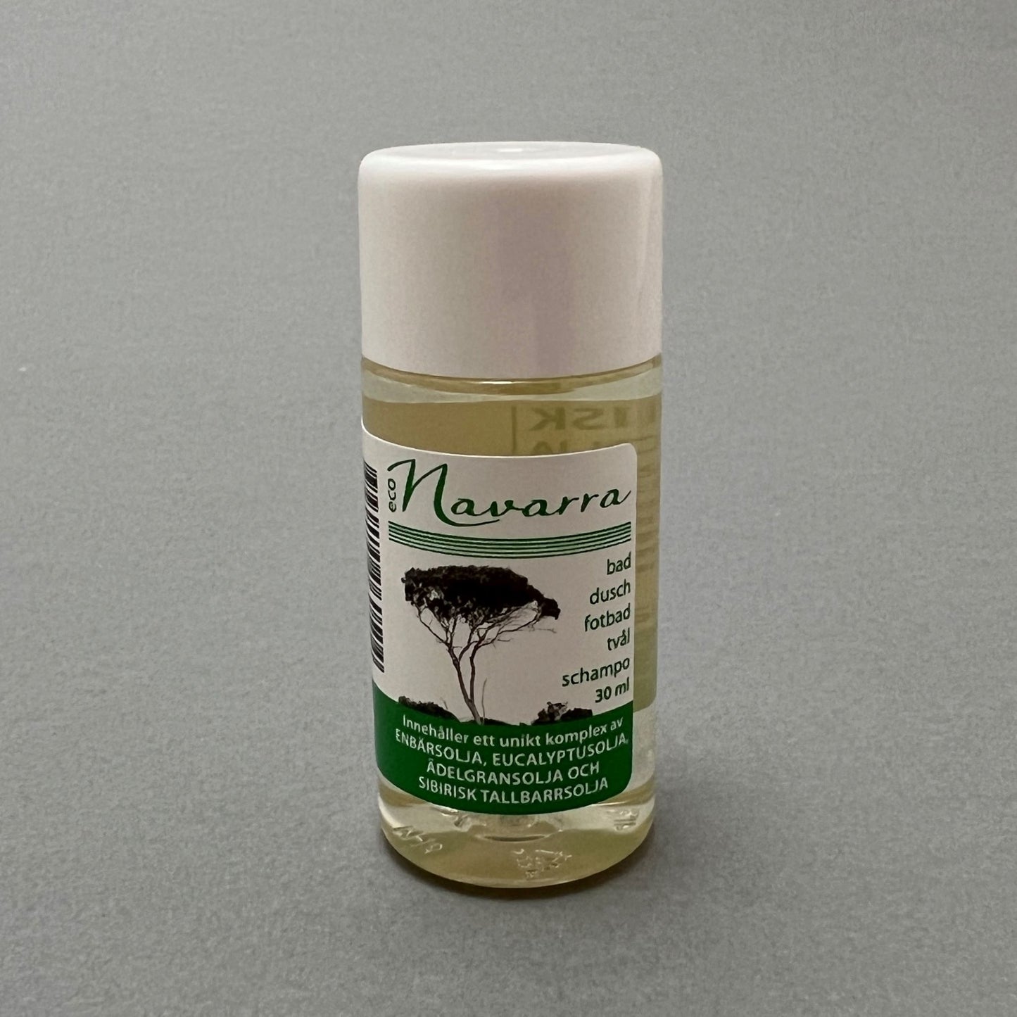 A 30ml white soap bottle containing Navarra health bath oil, standing on a gray background