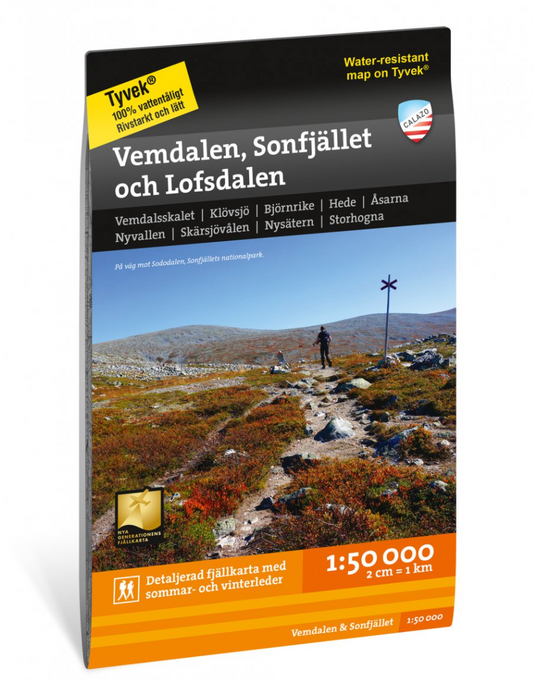 A black and orange colored book called called "Vemdalen, Sonfjället and Lofsdalen" with a picture of a mountain trail on the cover