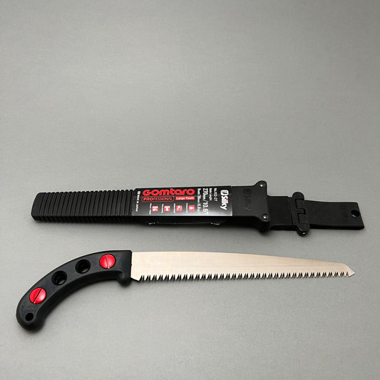 Silky Gometero 27-8 pruning saw laying next to belt holster on a gray background